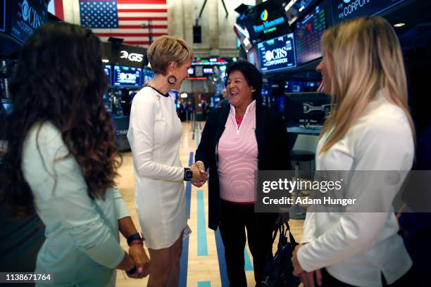 Gerri Willis shakes hands with Nancy Lopez at the New York Stock Exchange for the Augusta National Women's Amateur press tour on March 27, 2019 in...