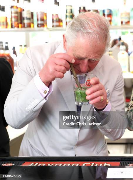 Prince Charles, Prince of Wales smells a mojito as he and Camilla, Duchess of Cornwall visit a paladar called Habanera, a privately owned restaurant...