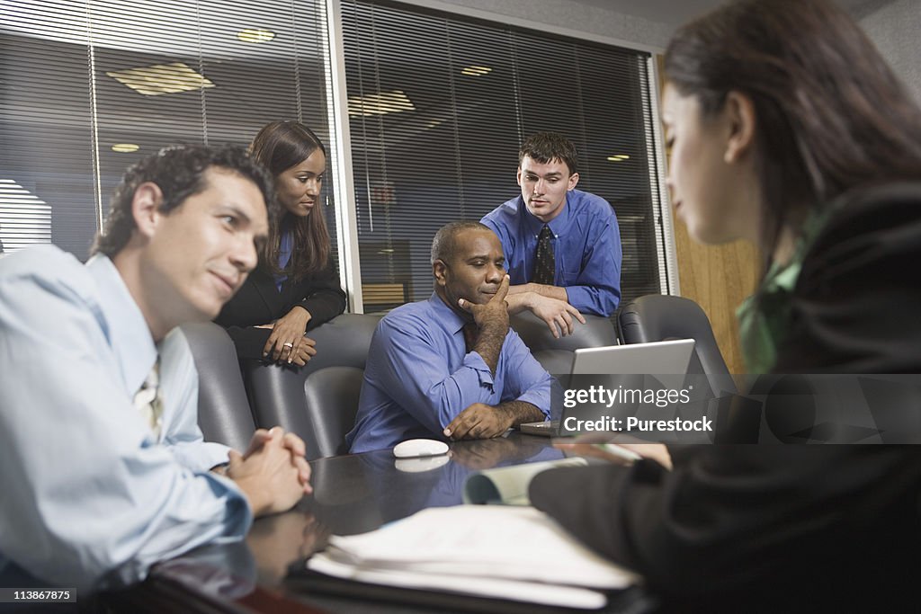 Businesspeople working in conference room