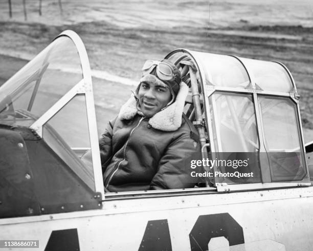 Portrait of Tuskegee Airman James R Smith in the cockpit of an Advanced Trainer at the Basic and Advanced Flying School for Negro Air Corps Cadets,...