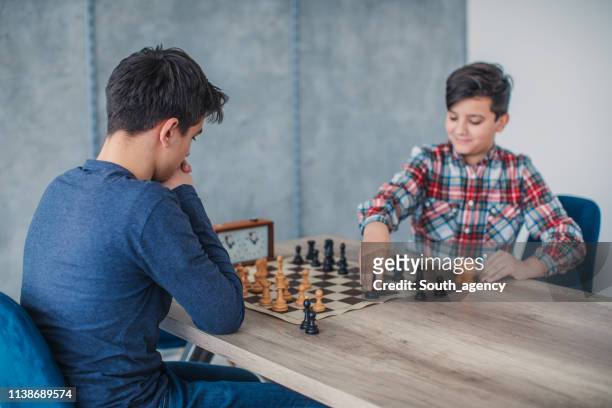 boys playing chess - chess timer stock pictures, royalty-free photos & images