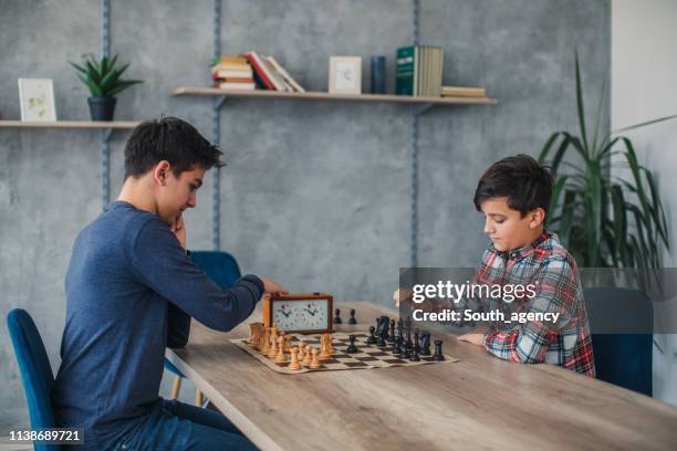 boys playing chess - chess timer stock pictures, royalty-free photos & images