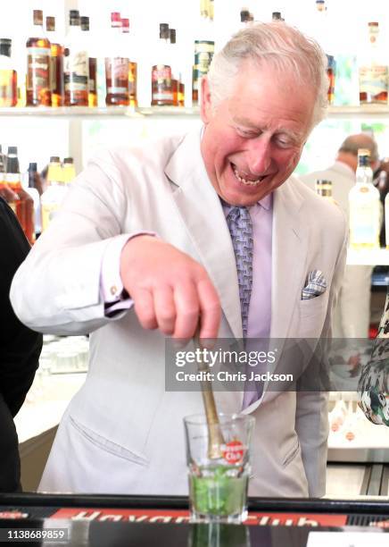 Prince Charles, Prince of Wales prepares a mojito as he and Camilla, Duchess of Cornwall visit a paladar called Habanera, a privately owned...