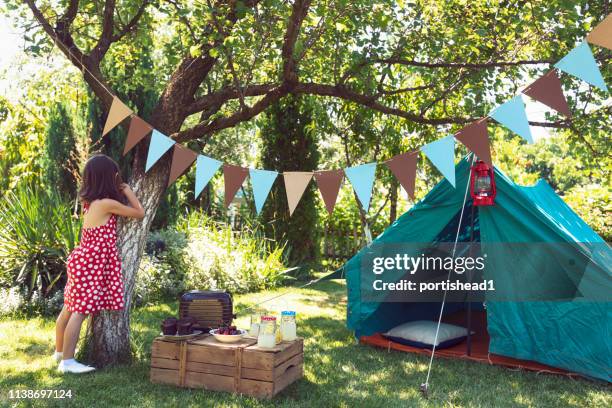 girl playing hide and seek - kids tent stock pictures, royalty-free photos & images