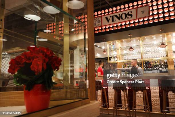 People work at Mercado Little Spain in the newly opened Hudson Yards development on March 27, 2019 in New York City. The 35,000-square-foot food...