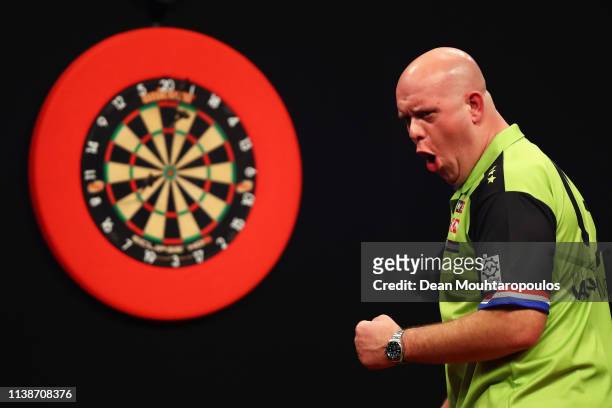 Michael van Gerwen of the Netherlands competes against Peter Wright of Scotland during day one of the 2019 Unibet Premier League Darts on March 27,...