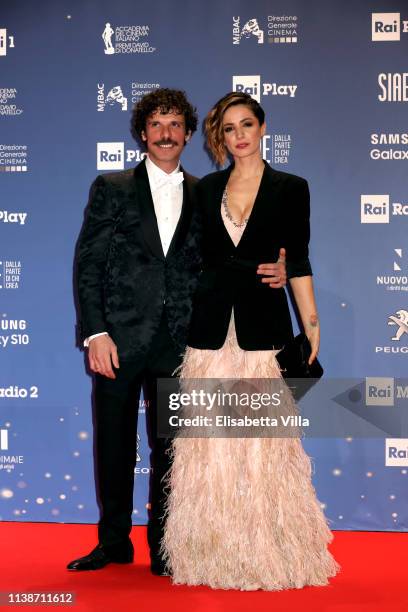 Francesco Montanari and Andrea Delogu attend the 64. David Di Donatello awards on March 27, 2019 in Rome, Italy.