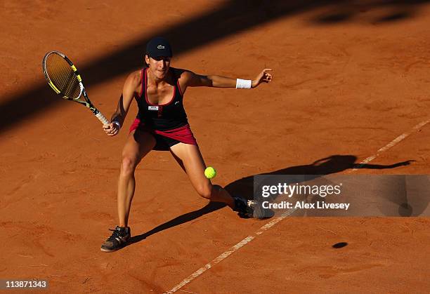 Arantxa Parra Santonja of Spain plays a return shot during her first round defeat to Marion Bartoli of France during day two of the Internazionali...