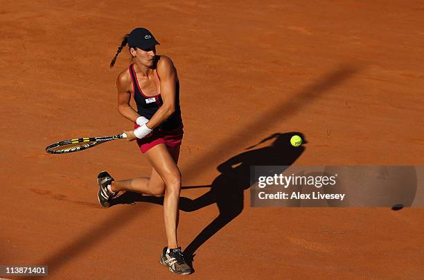 Arantxa Parra Santonja of Spain plays a return shot during her first round defeat to Marion Bartoli of France during day two of the Internazionali...