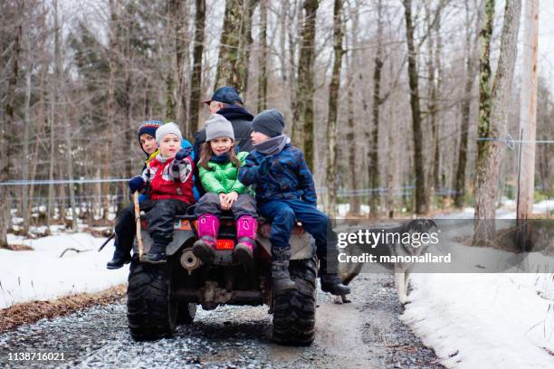 children during time of maple syrup family industry - snow melting on car stock pictures, royalty-free photos & images