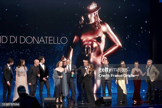 Cast members of the movie 'A casa tutti bene' receive the David Dello Spettatore Award during the 64. David Di Donatello Award Ceremony on March 27,...