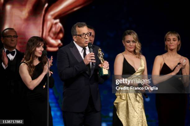 Cast members of the movie 'A casa tutti bene' receive the David Dello Spettatore Award during the 64. David Di Donatello Award Ceremony on March 27,...