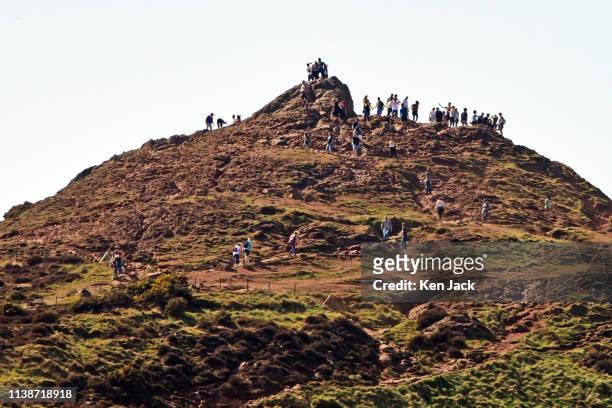 People climb Arthur's Seat in the sun as Edinburgh enjoys another day of soaring temperatures on Easter Monday, on April 18, 2019 in Edinburgh...