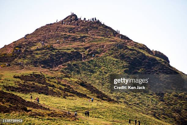 People climb Arthur's Seat in the sun as Edinburgh enjoys another day of soaring temperatures on Easter Monday, on April 18, 2019 in Edinburgh...