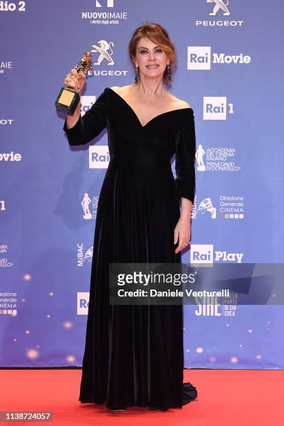 Elena Sofia Ricci poses with the best actress award during the 64. David Di Donatello - Award Ceremony on March 27, 2019 in Rome, Italy.