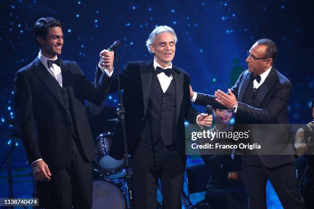 Matteo and Andrea Bocelli and Carlo Conti on the stage during the 64. David Di Donatello Award Ceremony on March 27, 2019 in Rome, Italy.