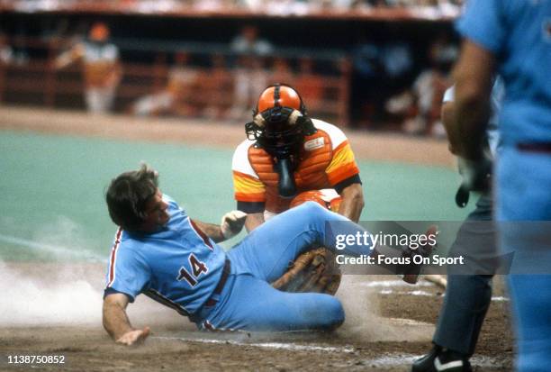 Pete Rose of the Philadelphia Phillies slides at home plate against the Houston Astros during a Major League Baseball game circa 1983 at the Houston...