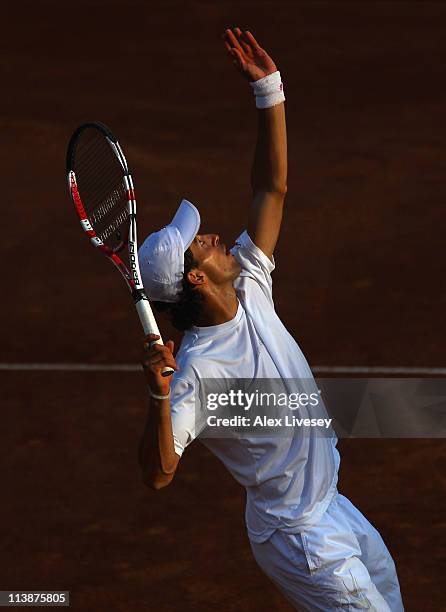 Santiago Giraldo of Columbia serves during his first round match against Mardy Fish of USA during day two of the Internazionali BNL d'Italia at the...