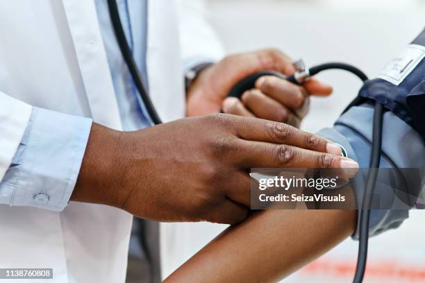 let's see if your blood pressure is high or low - primary care stock pictures, royalty-free photos & images
