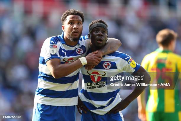 Liam Moore and Andy Yiadom of Reading waiting for confirmation they're safe from relegation during the Sky Bet Championship fixture between Reading...