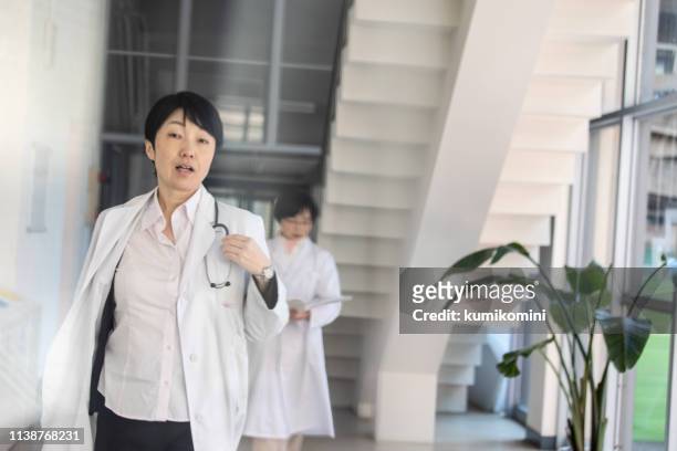 japanese female doctor - emergency response stock pictures, royalty-free photos & images