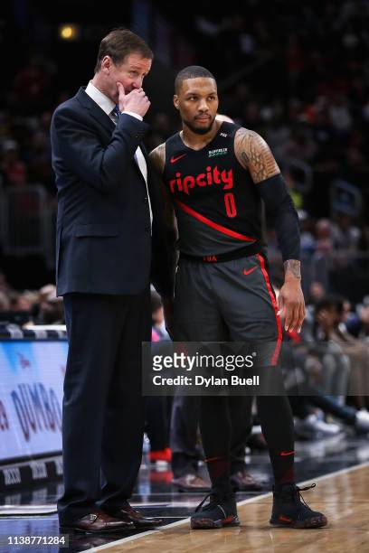 Head coach Terry Stotts of the Portland Trail Blazers meets with Damian Lillard in the third quarter against the Chicago Bulls at the United Center...