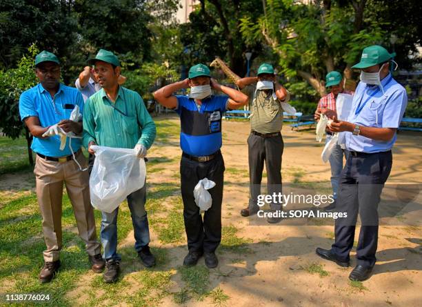 People are seen collecting garbage from a Public park with an Oath to make Earth a better place during the World Earth Day celebration. An NGO named...