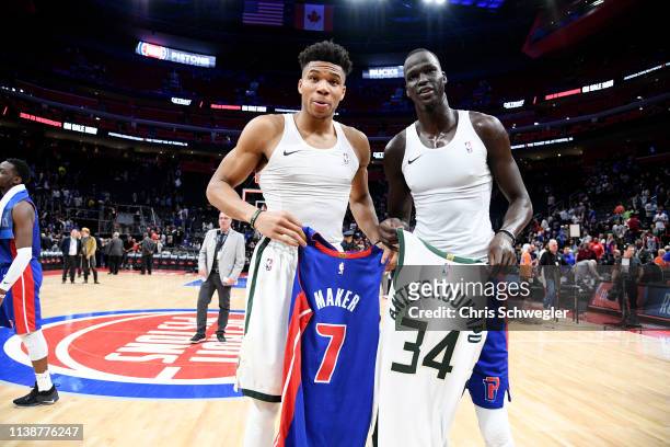 Giannis Antetokounmpo of the Milwaukee Bucks and Thon Maker of the Detroit Pistons exchange jerseys after Game Four of Round One of the 2019 NBA...