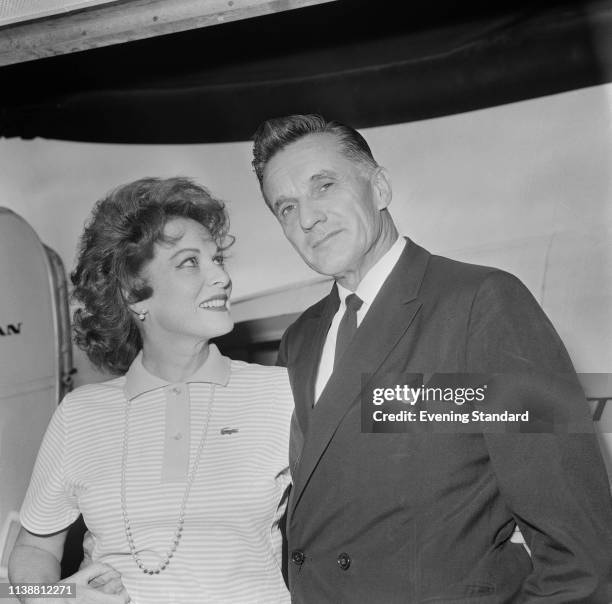 Irish-American actress and singer Maureen O'Hara and her husband, Charles Blair Jr at heathrow Airport, London, UK, 23rd July 1969.