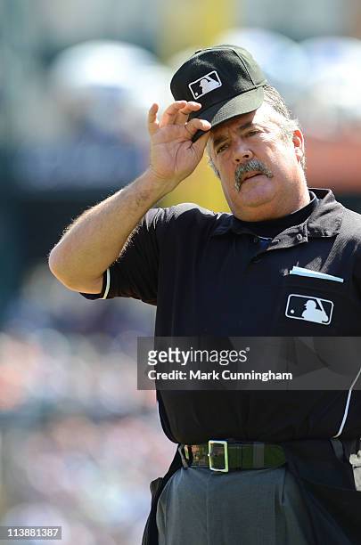Major League umpire Tim Tschida looks on during the game between the Detroit Tigers and the New York Yankees at Comerica Park on May 5, 2011 in...