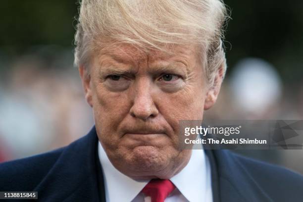 President Donald Trump speaks to members of the media on the South Lawn prior to his departure from the White House on March 22, 2019 in Washington,...