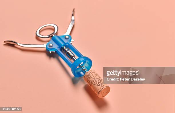 blue corkscrew, on beige background - wine cork stock pictures, royalty-free photos & images