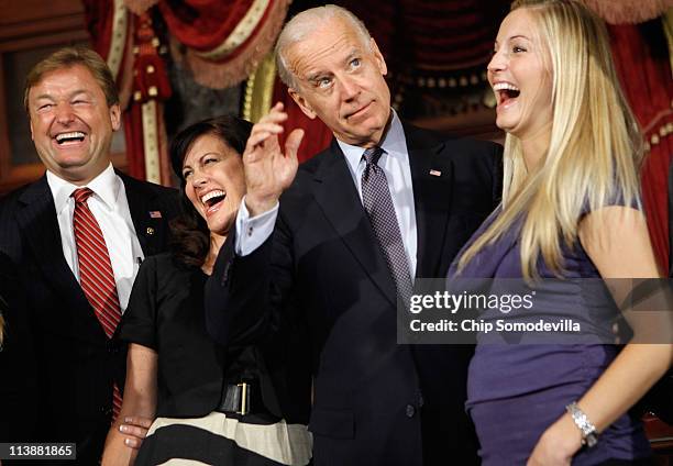 Sen. Dean Heller , his wife Lynne Heller and daughter Hilary Ableser laugh at a joke told by Vice President Joe Biden after Heller's mock swearing-in...
