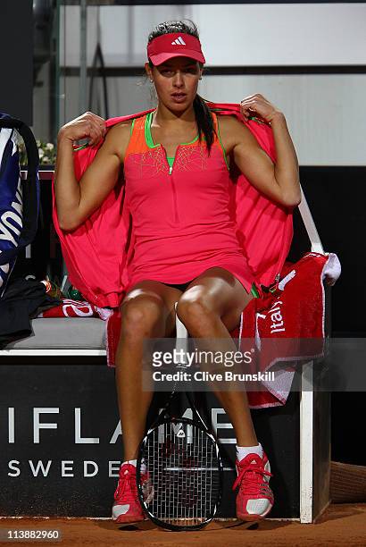 Ana Ivanovic of Serbia feels the cold during her first round match against Nadia Petrova of Russia during day two of the Internazoinali BNL D'Italia...