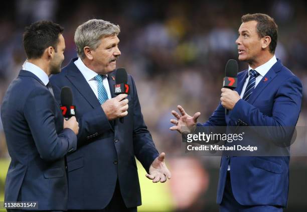 Television commentators James Bartel Brian Taylor and Wayne Carey are seen during the AFL Round match between Richmond v Collingwood at Melbourne...