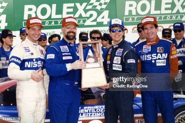 Butch Leitzinger, Paul Gentilozzi, Scott Pruett and Steve Millen enjoy their moment in Daytona International Speedway's victory lane after the...