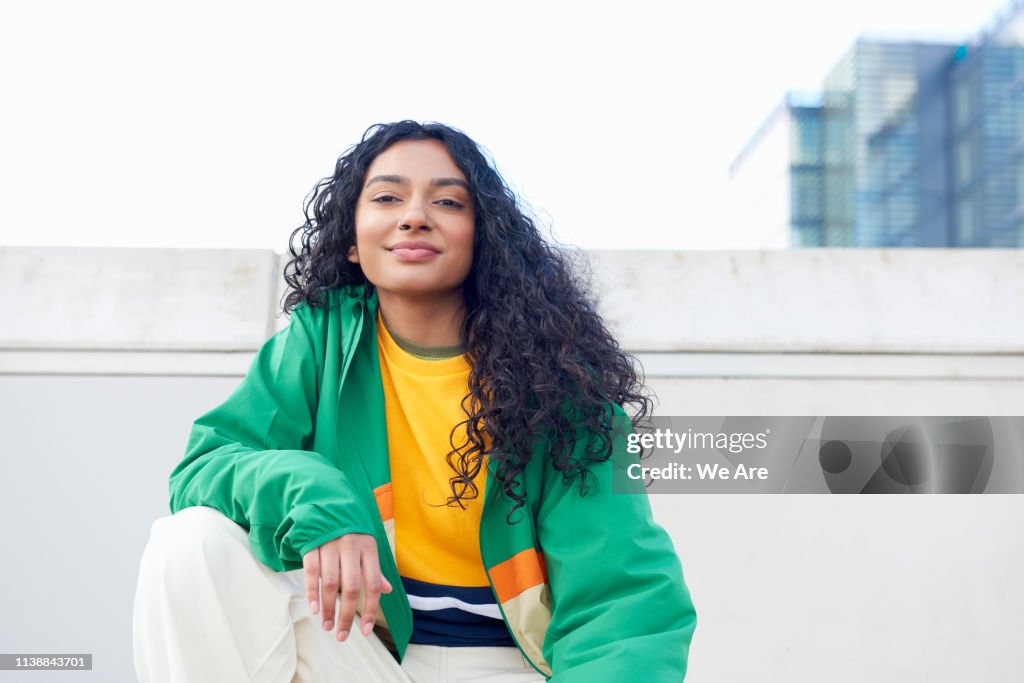 Portrait of woman in city street