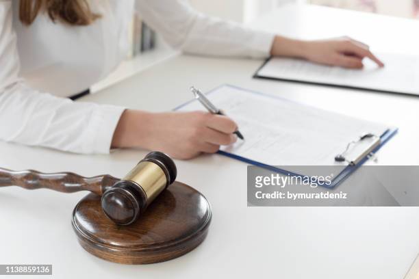 lawyer read contract - law office stock pictures, royalty-free photos & images