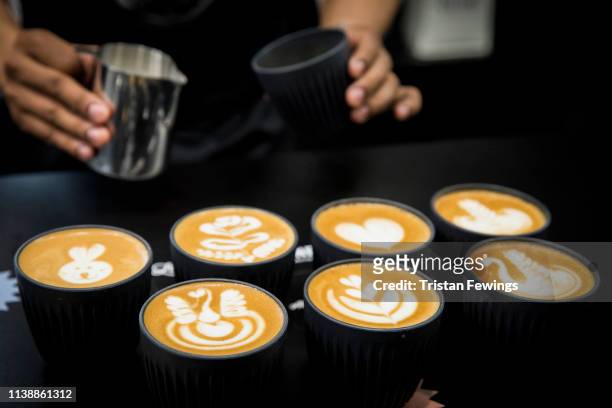 Latte Art Champion Dhan Tamang demonstrates latte art during the London Coffee Festival 2019 at Old Truman Brewery on March 28, 2019 in London,...