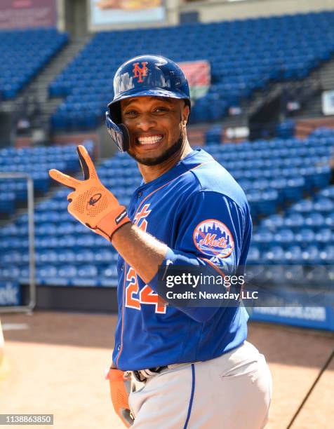 New York Mets infielder Robinson Cano flashes a peace sign during a split-squad game at spring training on February 22, 2019 in Port St. Lucie, FL.