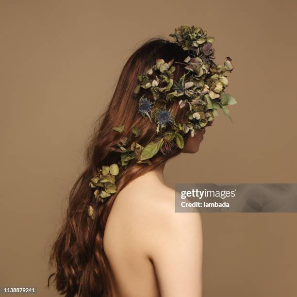 rear view of young woman and flowers - fantasy portrait stock pictures, royalty-free photos & images