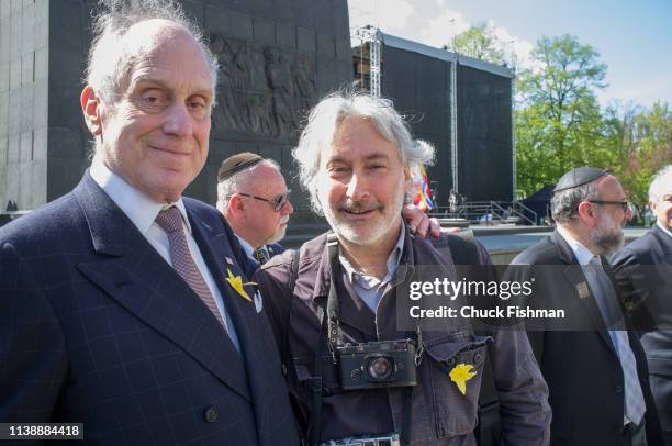 Portrait of American businessman & World Jewish Congress President Ronald Lauder and photographer Chuck Fishman as they pose beside the Ghetto Heroes...