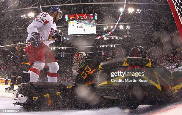 Dennis Endras ,goaltender of Germany makes a save on Jan Marek of Czech Republic during the IIHF World Championship qualification match between...