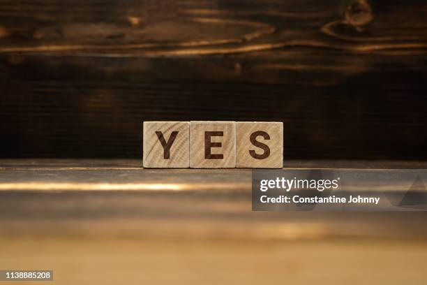 yes word on wooden blocks - yes foto e immagini stock