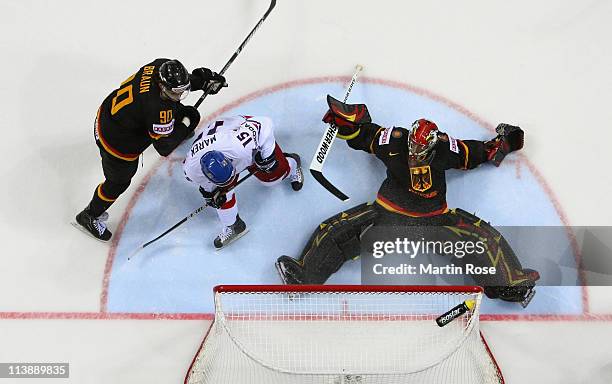 Dennis Endras ,goaltender of Germany makes a save on Jan Marek of Czech Republic during the IIHF World Championship qualification match between...