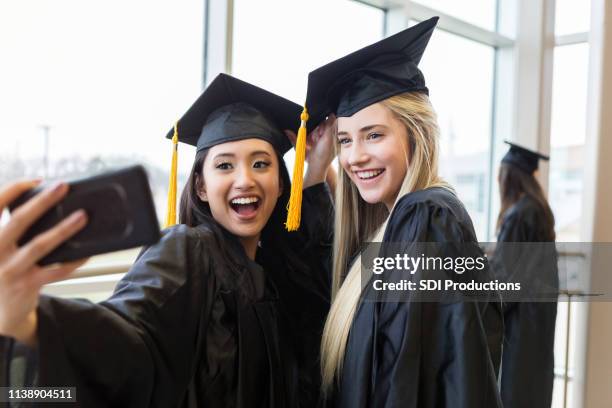 high school friends graduate from high school - traje academico imagens e fotografias de stock