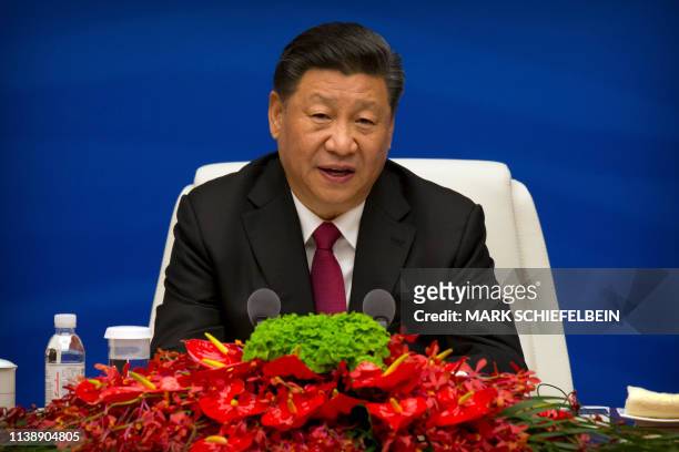 Chinese President Xi Jinping speaks during an event to commemorate the 70th anniversary of the Chinese People's Liberation Army Navy in Qingdao, in...