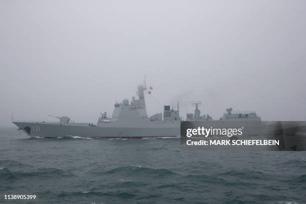 The type 052D guided missile destroyer Taiyuan of the Chinese People's Liberation Army Navy participates in a naval parade to commemorate the 70th...