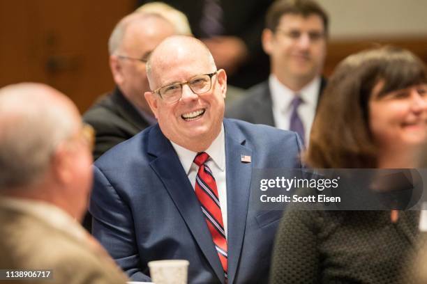 Maryland Governor Larry Hogan laughs before being introduced at the New Hampshire Institute of Politics as he mulls a Presidential run on April 23,...