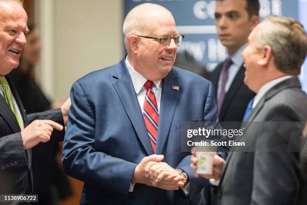 Maryland Governor Larry Hogan speaks with attendees before being introduced at the New Hampshire Institute of Politics as he mulls a Presidential run...